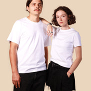 Two people wearing white t-shirts against a beige background