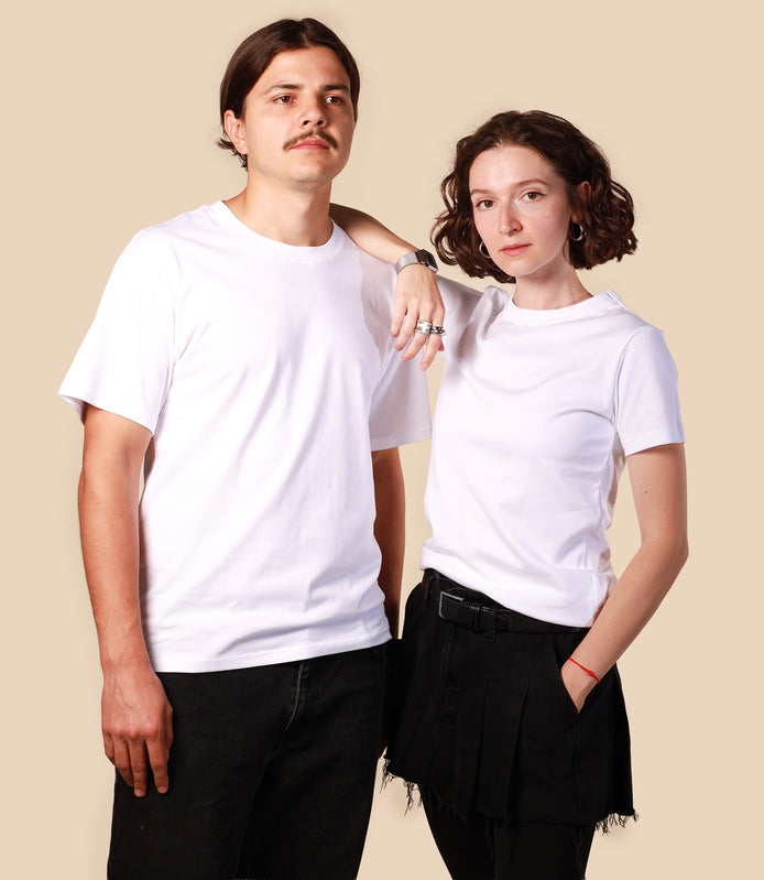 Two people wearing white t-shirts against a beige background